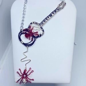 DISCOUNTED for Halloween//Handmade wire wrapped guitar necklace.